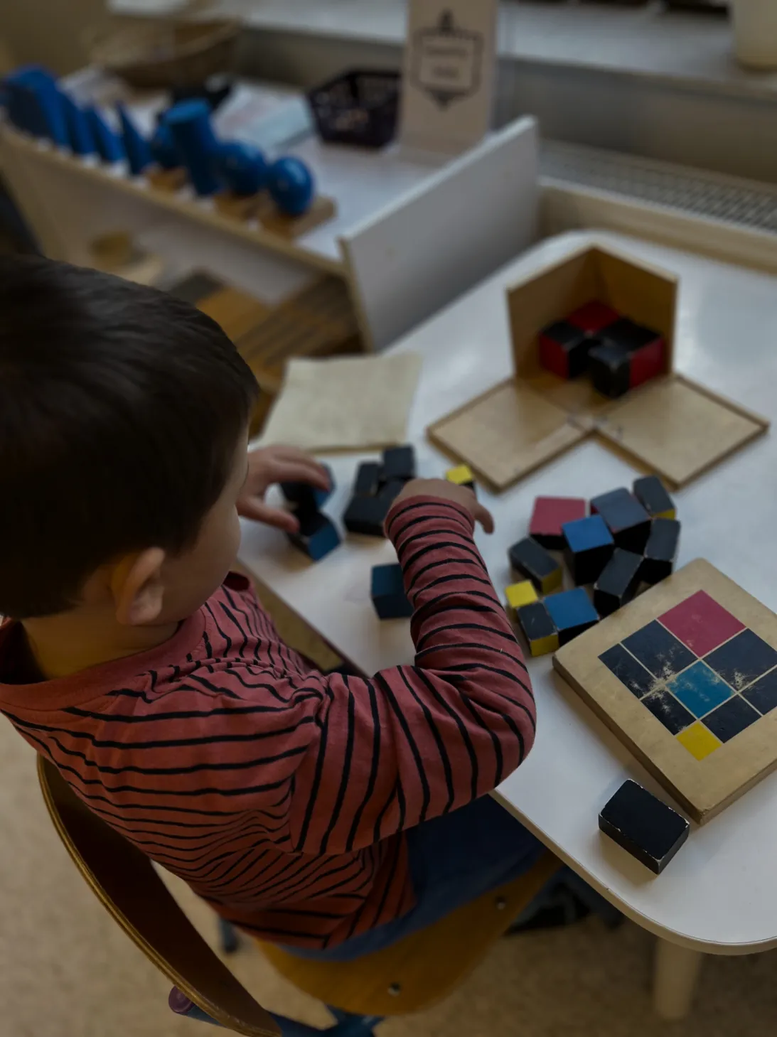 Children exploring Montessori materials