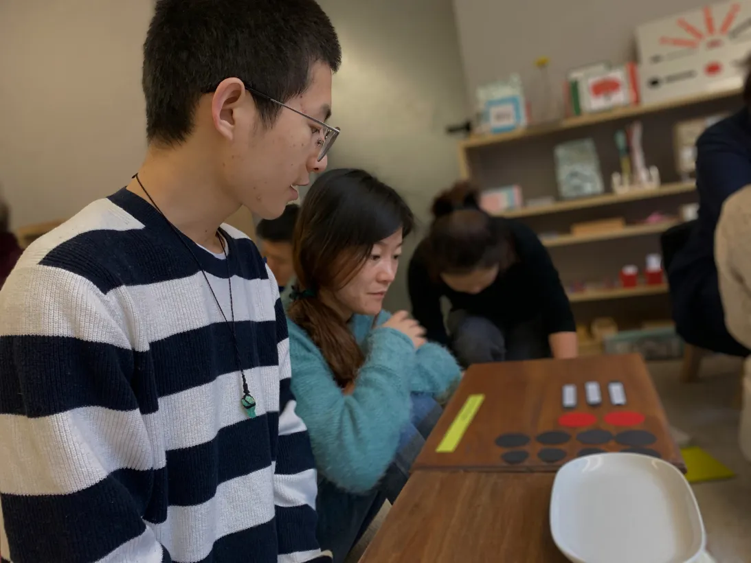 Children working independently with Montessori materials