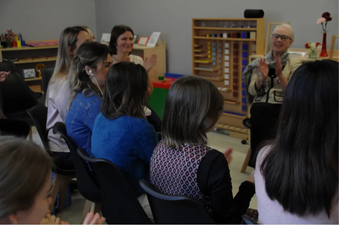 AMI trainer supporting a Montessori classroom